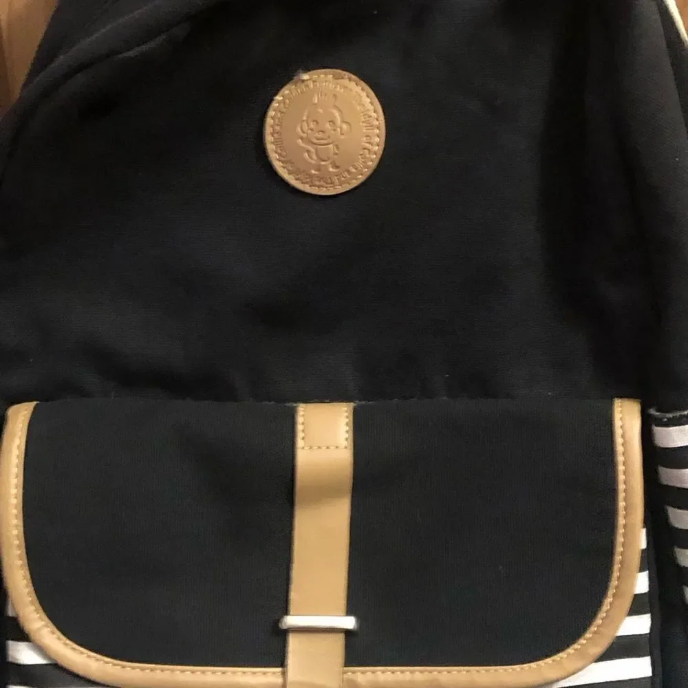 The Idyll of Collie Striped Canvas Backpack With Adjustable Straps Locker Hook.